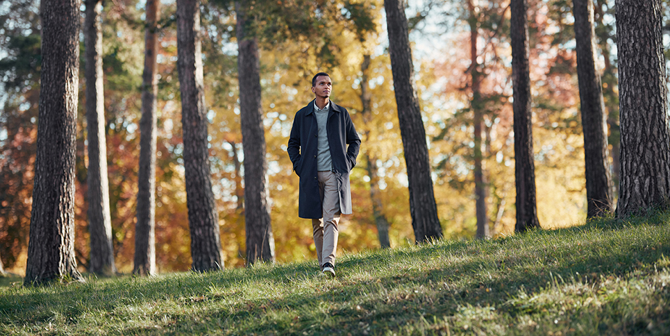 a man walking in a forest