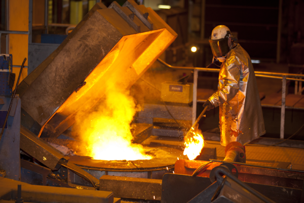 a man wearing a protective suit working on a machine