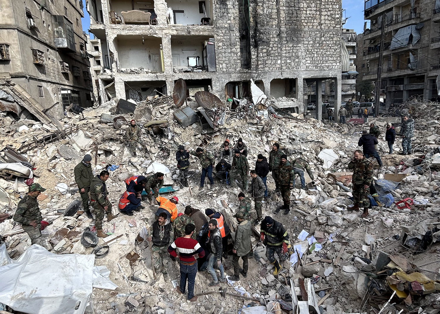 Rescue workers searching the ruins for survivors