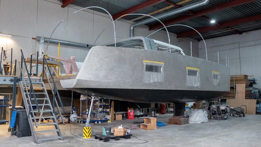 a large metal structure with ladders and boxes in a warehouse