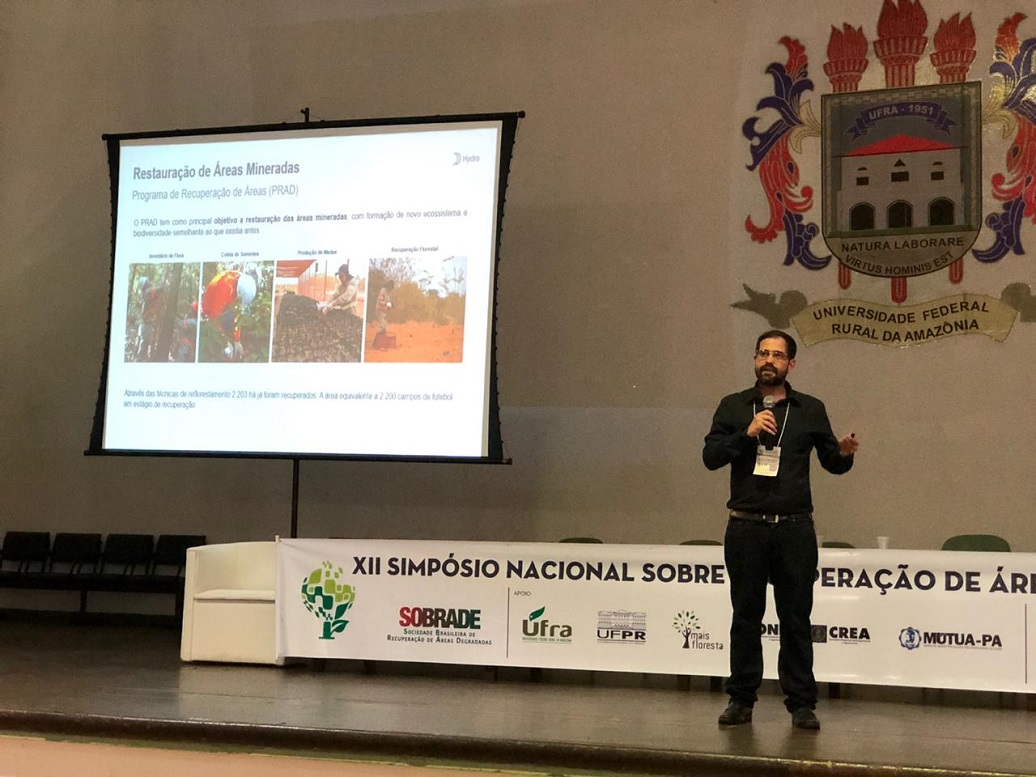 a person standing in front of a screen