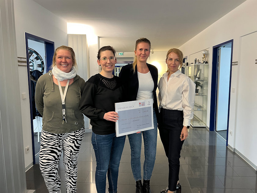 a group of women standing in a hallway