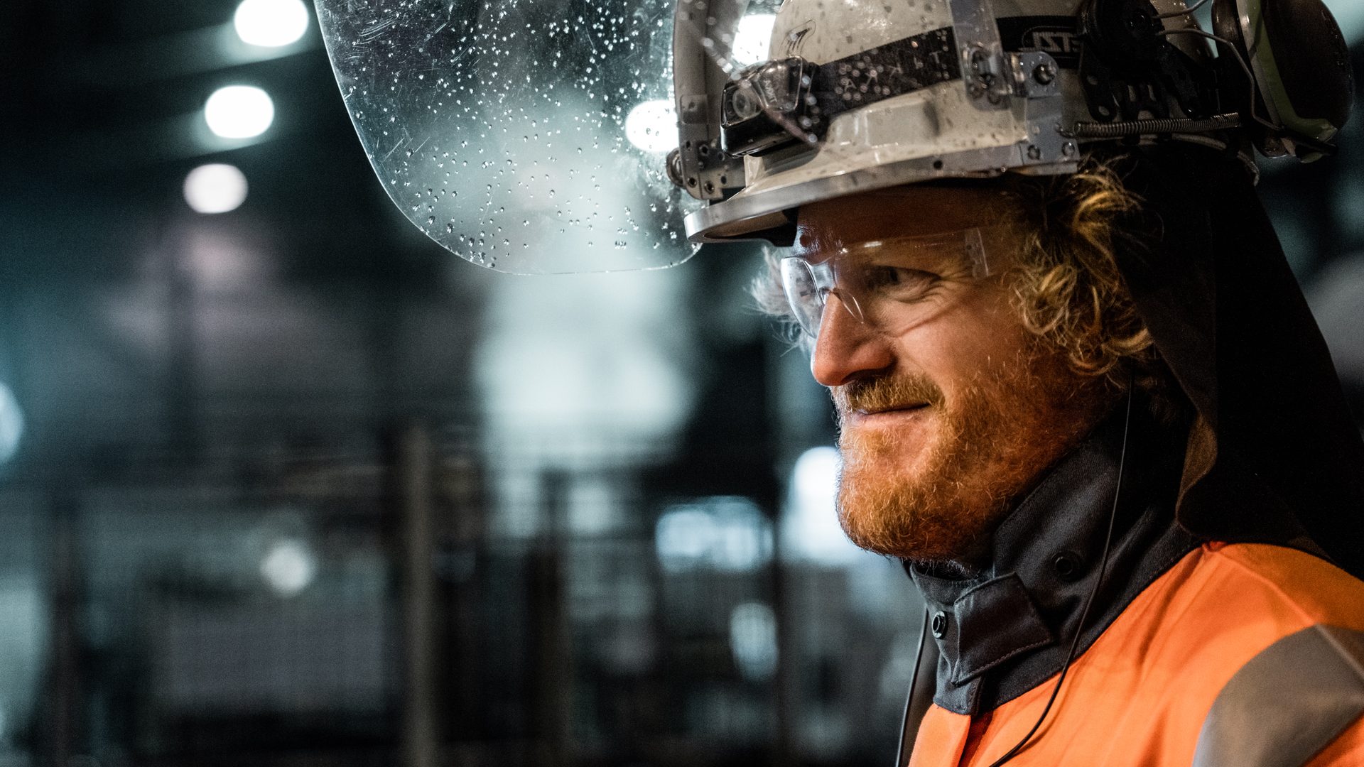 a man wearing a hard hat and goggles