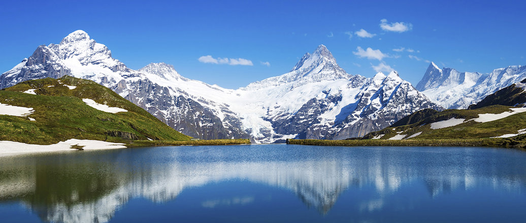 snow covered mountains and a lake