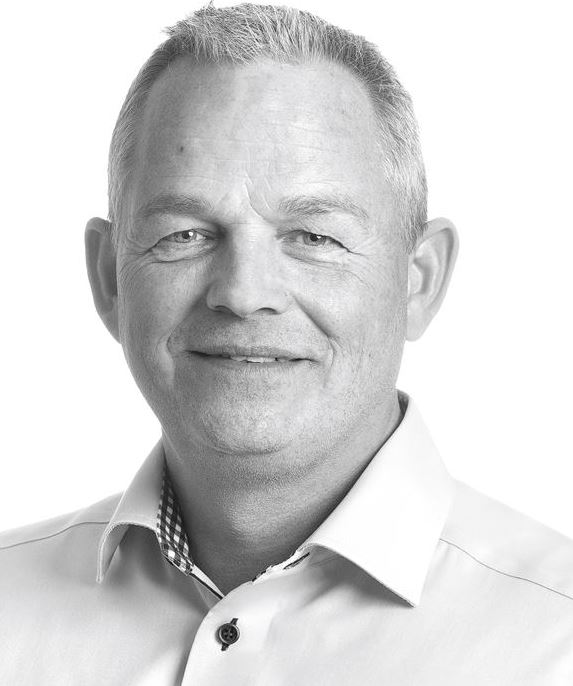 a man smiling for the camera