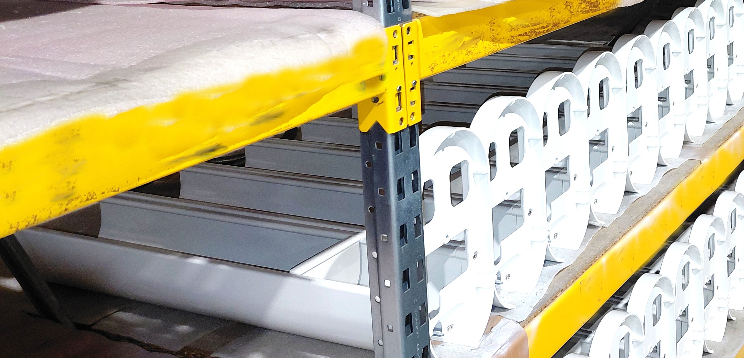 a shelf with white plastic parts