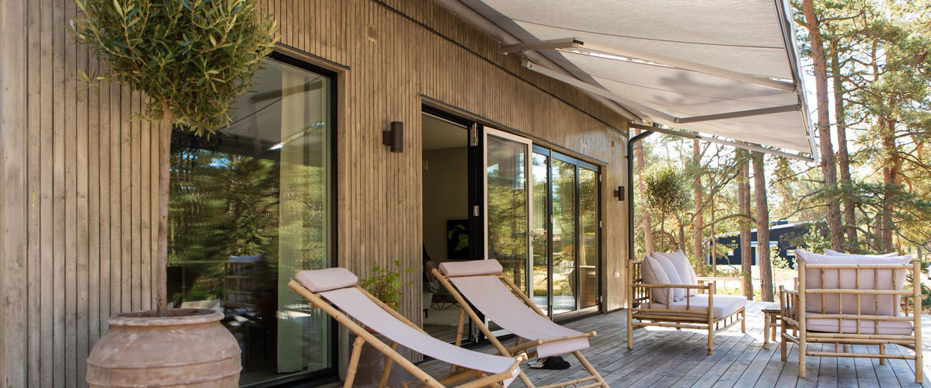 a deck with a chair and a table on it